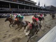 Flavien Prat ride Country House, left, to the finish line during the 145th running of the Kentucky Derby horse race at Churchill Downs Saturday, May 4, 2019, in Louisville, Ky. Country House was declared the winner after Maximum Security was disqualified following a review by race stewards.