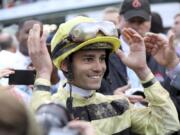 Jockey Flavien Prat reacts learning he won the 145th running of the Kentucky Derby horse race when Maximum Security was disqualified at Churchill Downs Saturday, May 4, 2019, in Louisville, Ky.