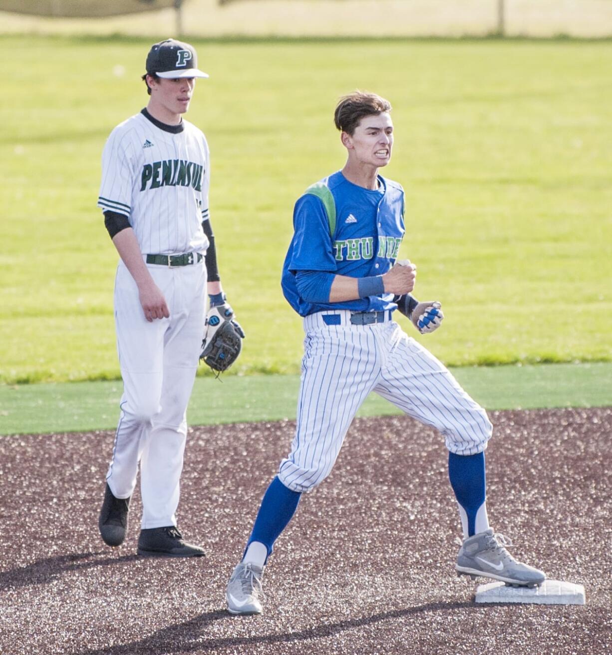 Mountain View's Quinn Rooks celebrates a sixth-inning double in an 8-3 win over Peninsula in the 3A bi-district tournament Saturday at Propstra Stadium.