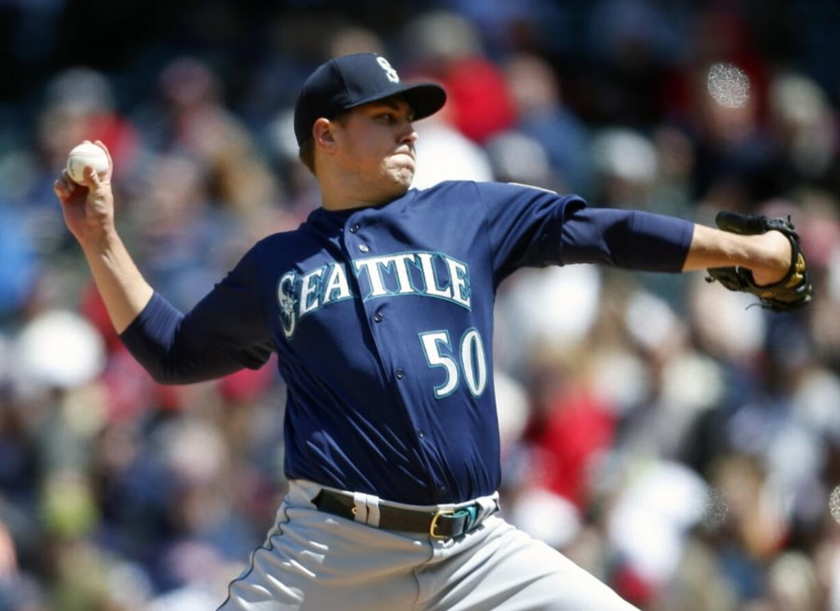 Seattle Mariners starting pitcher Erik Swanson delivers against the Cleveland Indians during the first inning of a baseball game, Sunday, May 5, 2019, in Cleveland.