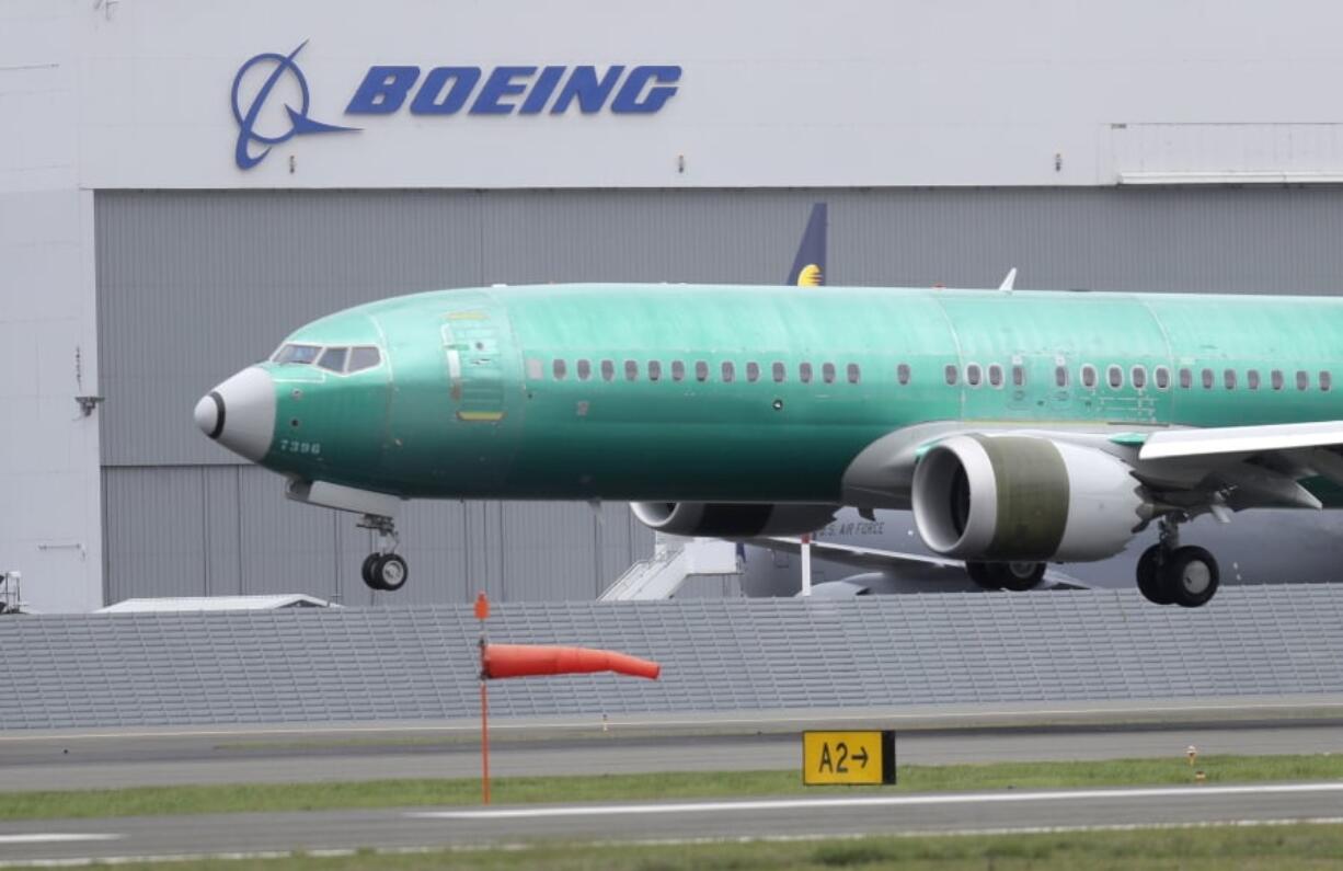 FILE - In this April 10, 2019, file photo a Boeing 737 MAX 8 airplane being built for India-based Jet Airways lands following a test flight at Boeing Field in Seattle. The grounding of Boeing 737 Max jets likely means that fare increases this summer will be larger than already expected and airlines will struggle to handle disruptions such as storms that shut down hub airports. (AP Photo/Ted S.