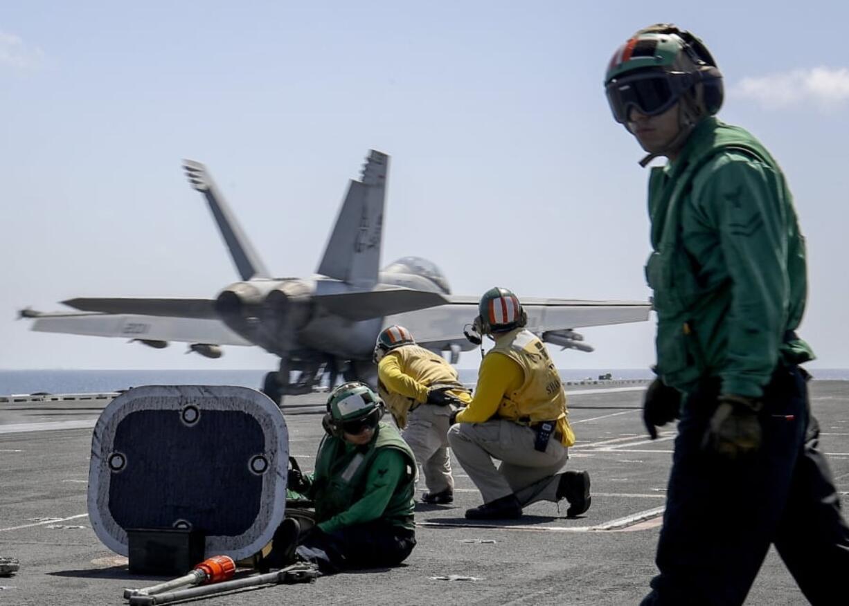 An F/A-18E Super Hornet from the “Jolly Rogers” of Strike Fighter Squadron (VFA) 103 launches from the flight deck of the Nimitz-class aircraft carrier USS Abraham Lincoln (CVN 72) on Arabian Sea. (Mass Communication Specialist 3rd Class Jeff Sherman/U.S.