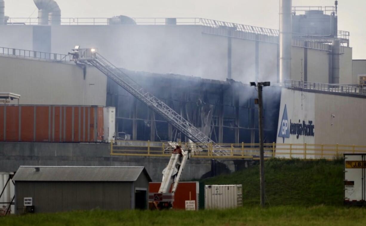 Firefighters battle a large fire at the Georgia-Pacific paper plant east of Muskogee on Tuesday, May 14, 2019.