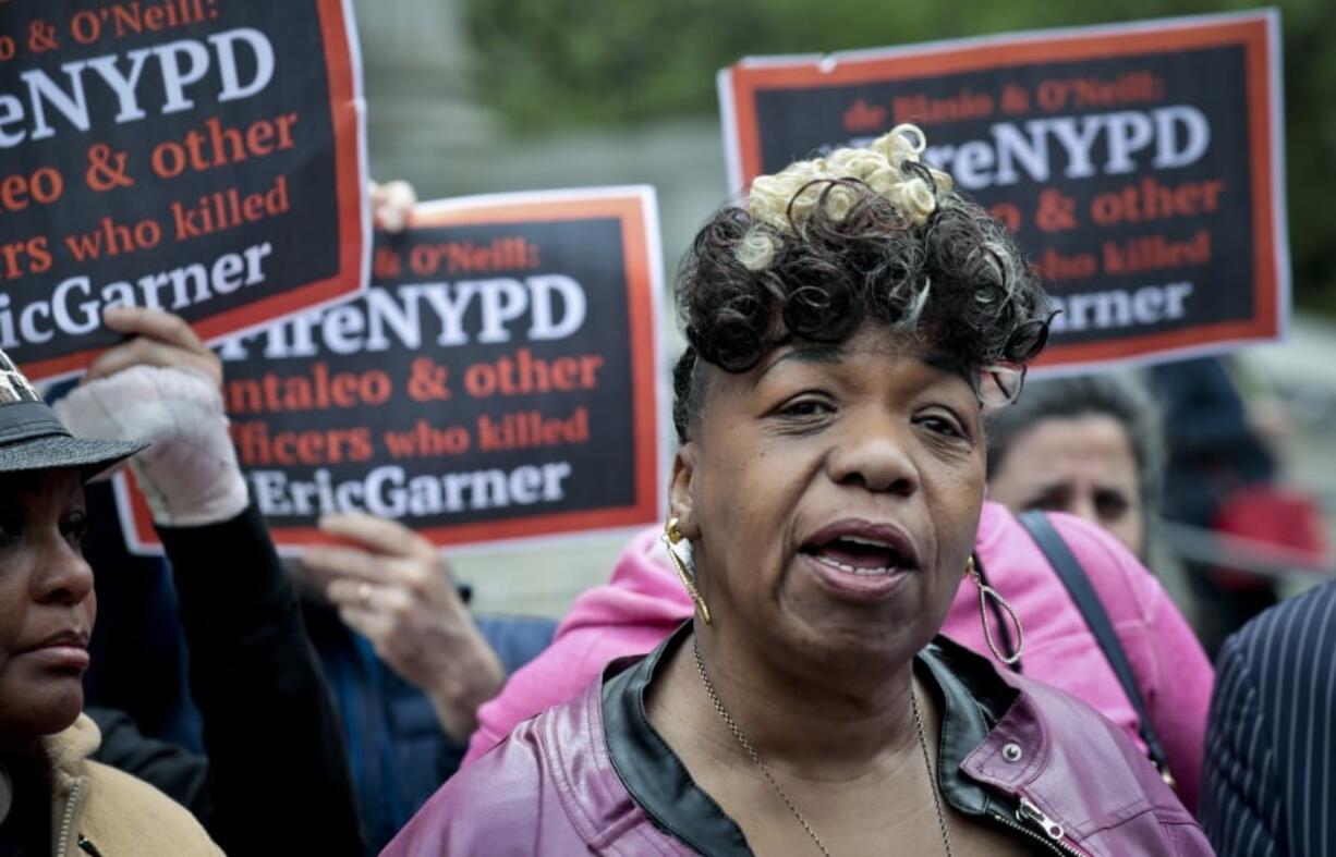 FILE - In this Thursday, May 9, 2019, file photo, Gwen Carr, left, mother of Eric Garner, an unarmed black man who died as he was being subdued in a chokehold by police Officer Daniel Pantaleo nearly five years earlier, speaks during a news conference after leaving court in New York. A long-delayed disciplinary trial is set to begin, Monday, May 13, 2019, for the New York City police officer accused of using a banned chokehold in Garner’s death in July 2014.