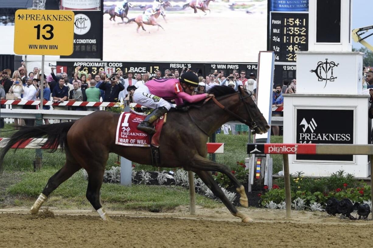 War of Will, ridden by Tyler Gaffalione, crosses the finish line first to win the Preakness Stakes horse race at Pimlico Race Course, Saturday, May 18, 2019, in Baltimore.