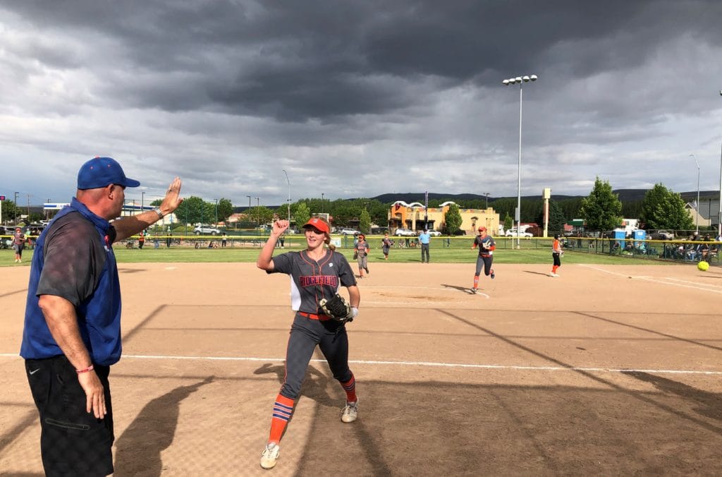 Kaia Oliver is congratulated after a strikeout to end the sixth inning in the 2A state quarterfinals against Ephrata on Friday in Selah. Oliver struck out 20 batters in the 6-0 Ridgefield victory.