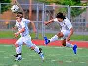 Columbia River's Marcos Diaz clears a ball in a 2A State semifinal game Friday at Sunset Chev Stadium in Sumner. Columbia River won 1-0.