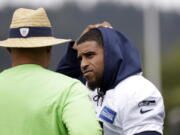 Seattle Seahawks’ Bobby Wagner, right, talks with defensive coordinator Ken Norton Jr. during an NFL football practice Tuesday, May 21, 2019, in Renton, Wash.