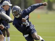 Seattle Seahawks rookie wide receiver DK Metcalf runs a drill during rookie mini camp Friday in Renton. It took one rookie minicamp practice for Metcalf to catch the attention of Seahawks coach Pete Carroll. “Maybe he’s even more unique than we thought coming in,” Carroll says. (AP Photo/Ted S.