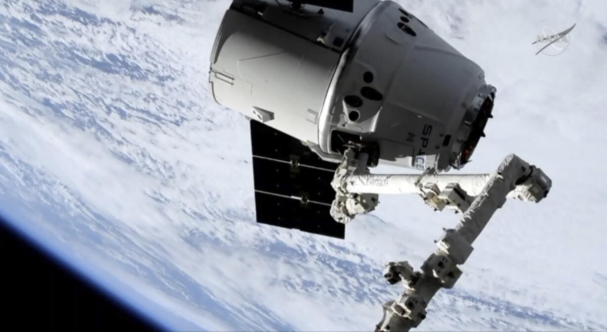 In this image taken from NASA Television, a SpaceX shipment prepares to arrive at the International Space Station following a weekend launch, Monday, May 6, 2019. The Dragon capsule reached the orbiting complex Monday, delivering 5,500 pounds (2,500 kilograms) of equipment and experiments.