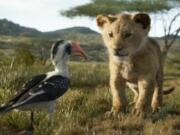 Zazu, voiced by John Oliver, left, and Simba, voiced by JD McCrary, in “The Lion King,” directed by Jon Favreau.