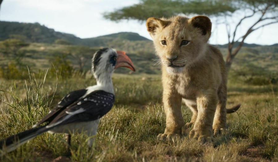 Zazu, voiced by John Oliver, left, and Simba, voiced by JD McCrary, in “The Lion King,” directed by Jon Favreau.