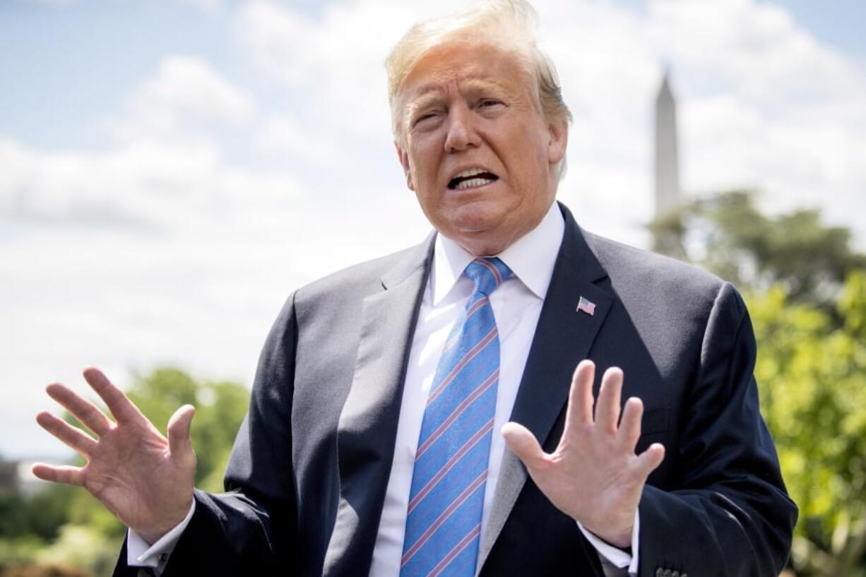 President Donald Trump speaks to members of the media on the South Lawn of the White House in Washington, Tuesday, May 14, 2019, before boarding Marine One for a short trip to Andrews Air Force Base, Md., to travel to Louisiana.