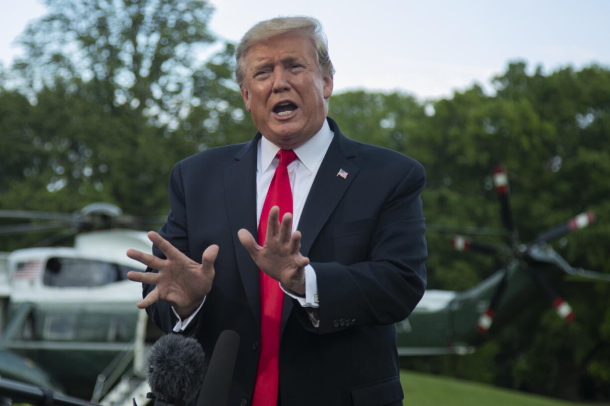 In this May 20, 2019, photo, President Donald Trump speaks to reporters on the South Lawn before leaving the White House in Washington. Three weeks have passed since Trump and Democratic congressional leaders agreed to work together on a $2 trillion package to invest in roads, bridges and broadband.