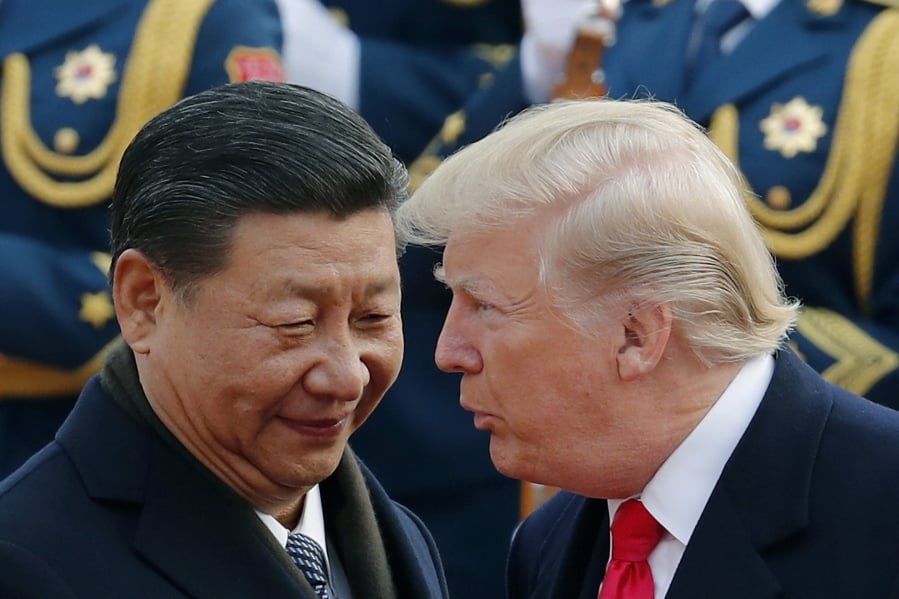 President Donald Trump chats with Chinese President Xi Jinping on Nov. 9, 2017, in Beijing.