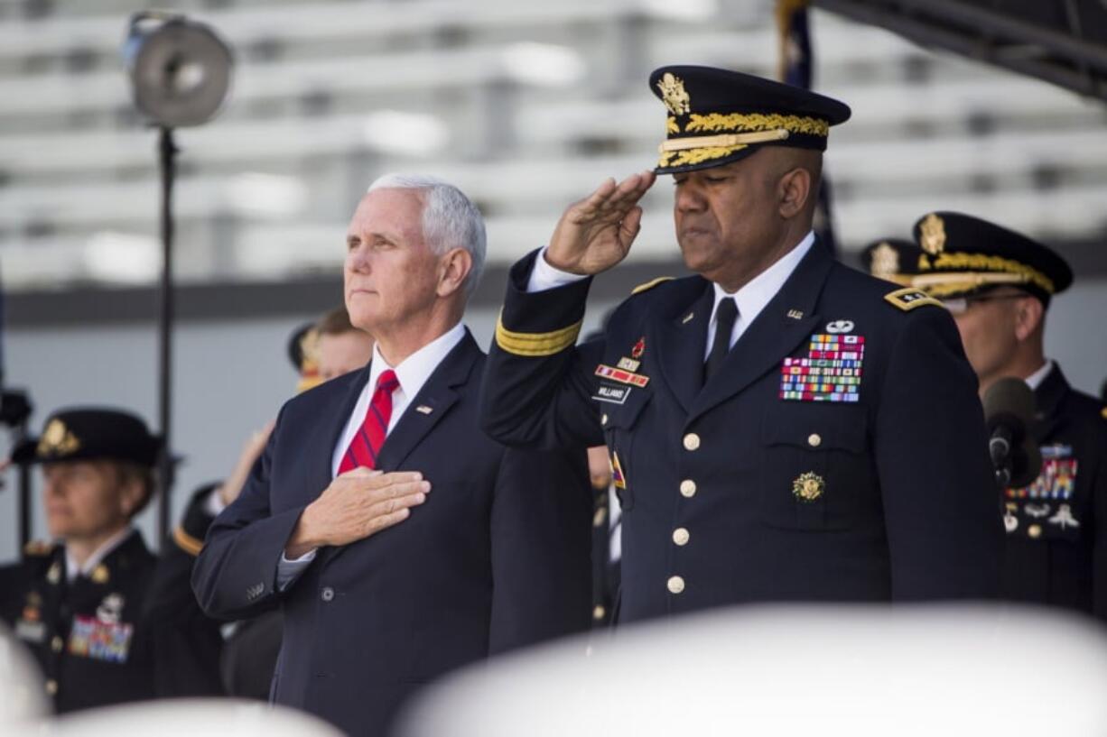 Vice President Mike Pence stands for the national anthem during graduation ceremonies at the United States Military Academy, Saturday, May 25, 2019, in West Point, N.Y.