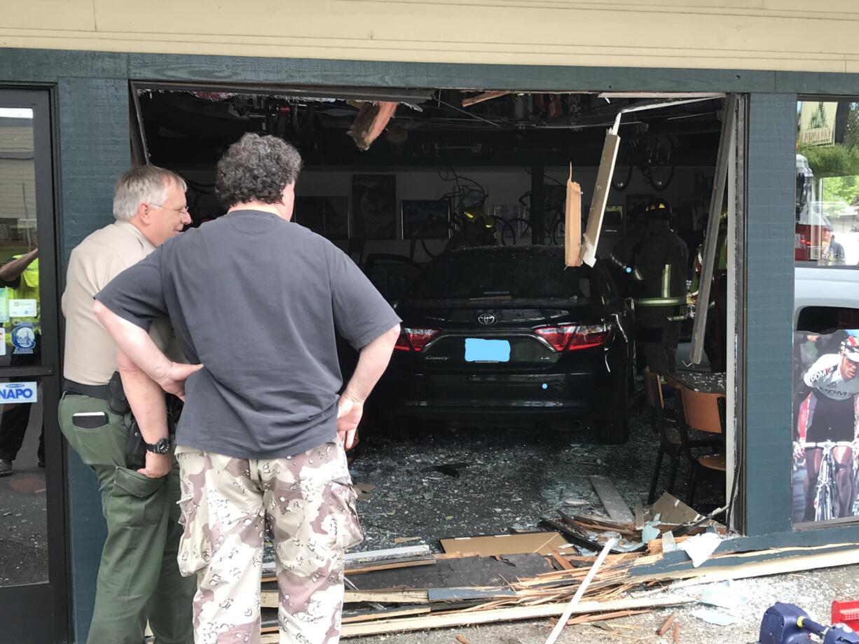 The driver of a dark-colored Toyota Camry reportedly mistook the gas pedal for the brake while attempting to park in front of Bortolami's Pizzeria, a news release said. Firefighters put the car into neutral and rolled it back, freeing the pinned woman. (Clark Co.