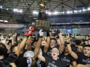 Union celebrates its win over Lake Stevens for the Class 4A state title on Dec. 1, 2018, in Tacoma. That game will be the last state championship football game in the Tacoma Dome for the forseeable future after the WIAA voted to find different venues for the games.