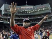 Boston Red Sox’s David Ortiz waves from the field at Fenway Park.