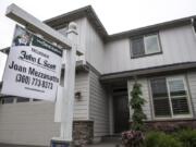 A for-sale sign in front of a home in Felida on May 16.