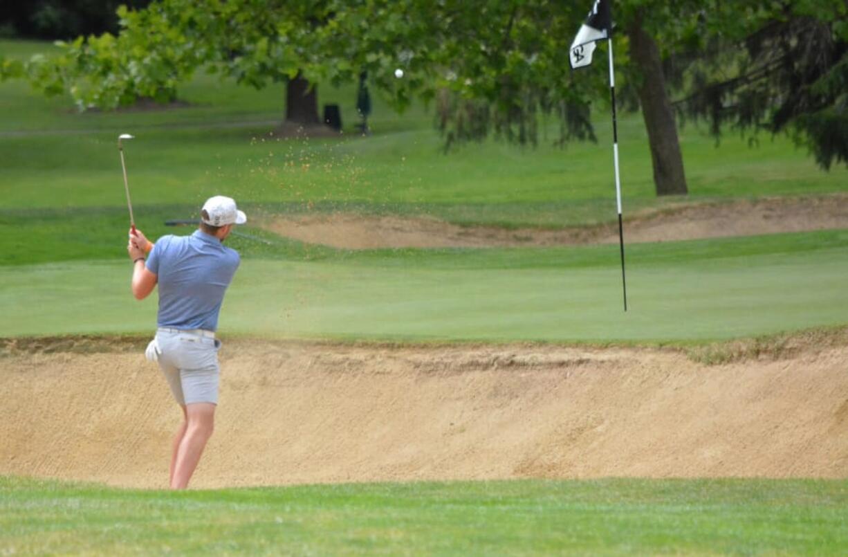 Spencer Tibbits hits out of a sand trap at Portland Golf Club during Saturday's championship round of the Oregon Amateur (Oregon Golf Association photo)