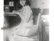 This April 1941 image released by the Anne Frank Foundation shows Anne Frank writing.