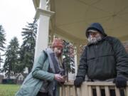 Katelyn Benhoff, lead outreach case manager with Share, left, speaks with a man who declined to give his name while performing the annual Point in Time Count on Jan. 24 in Vancouver’s Esther Short Park.