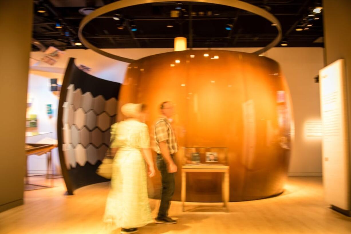 Visitors to the Museum of the Bible outside an exhibit that plays a surprising range of popular music that was influenced by the Bible.