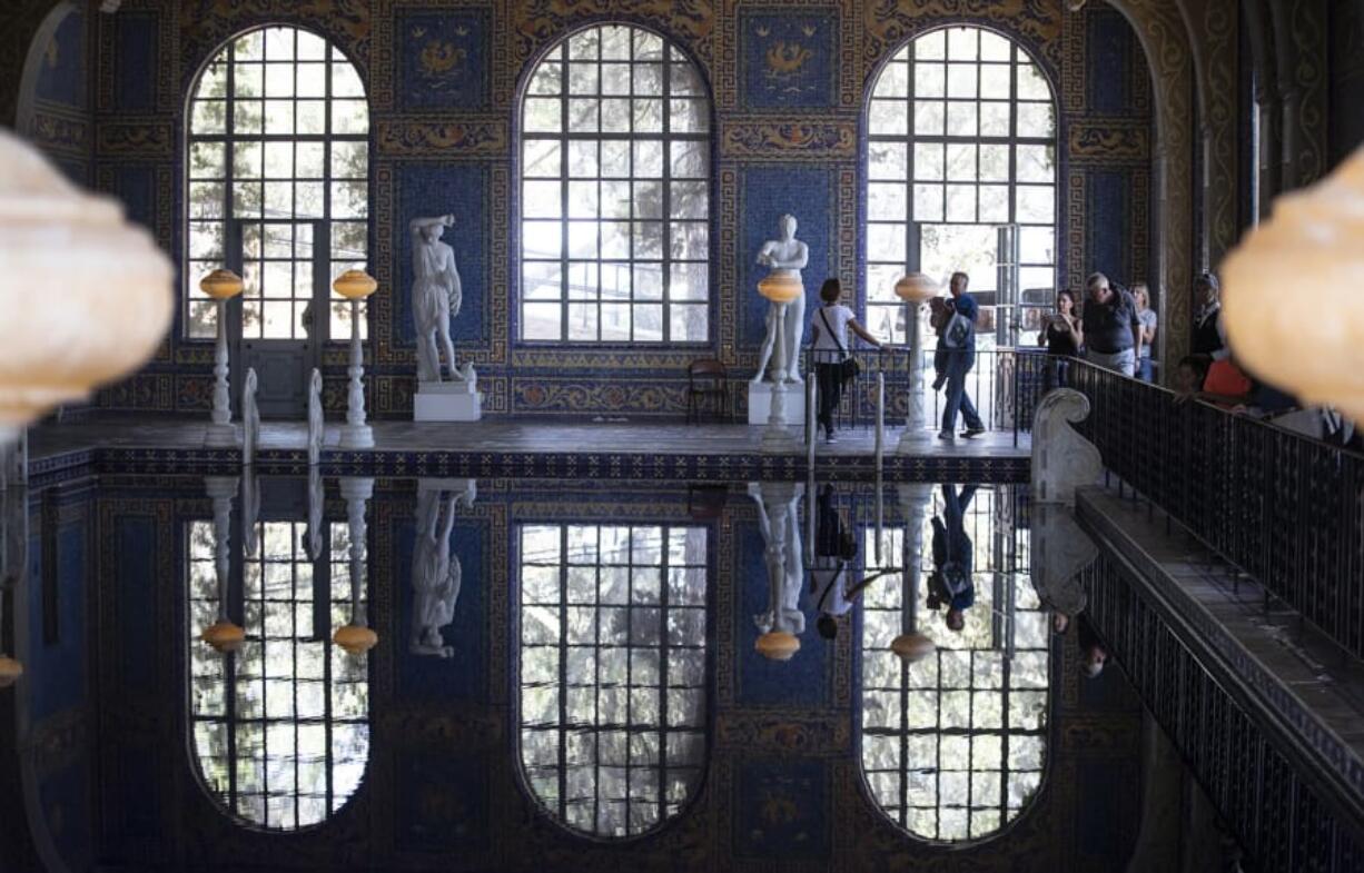 Tourists walk through the indoor Roman Pool at Hearst Castle on Aug. 1, 2018 in San Simeon, Calif.