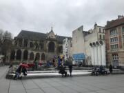 The Stravinsky Fountain sits between the Centre Pompidou museum and Saint-Merri church.