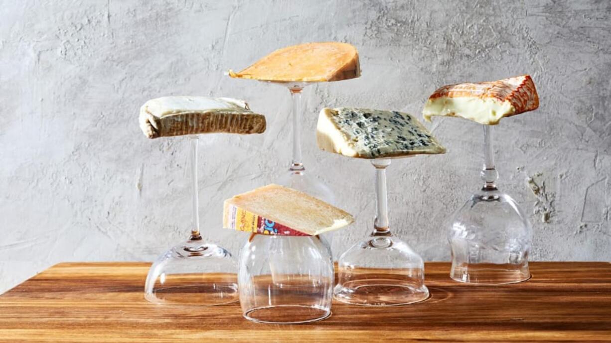 Cheeses, clockwise from top left: Bucheron, Beemster X-O Gouda, Saint Agur, Brebirousse and Piave Vecchi.