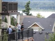 Investigators work at the scene of a stabbing assault on West Lookout Ridge Drive in Washougal on Tuesday morning, June 18, 2109.