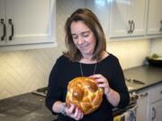 Lisa Spiegel prepares a round challah loaf. The bread is a Jewish tradition that dates back centuries.