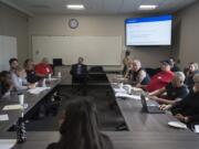 Jim Jensen, center, listens at a Clark County Opioid Task Force meeting in May at Bridgeview Resource Center in Vancouver. The task force is bringing diverse voices together to tackle the opioid epidemic in Clark County.