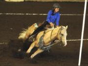 Contestant Hailey Saeman rides Chex to Chex in the figure 8 competition on Sunday during the 4-H Horse Pre-Fair Performance Show at the Clark County Event Center at the Fairgrounds.