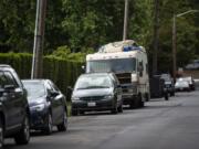 An RV is parked outside the entrance of the Hazel Dell RV Park in Vancouver on June 6. The sight of such vehicles often prompts complaints to county officials.