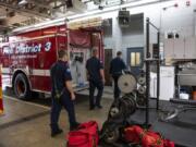 Fire District 3 firefighters walk through the garage, the same space where the workout area is now located, to the conference room for a fire investigation training at the Station 35 in Battle Ground. The city is discussing annexing into Fire District 3 instead of continuing to contract with the agency, which would potentially give Fire District 3 more say over fire service in the city. Chief Scott Sorenson said the district is looking at two locations for building a new fire station, since the one on Southwest First Avenue is too cramped and in a bad location to serve the city’s growth.