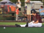 Ridgefield's Cameron Repetti catches his breath at first base after being tagged in a pickle during a game against Yakima at the Ridgefield Outdoor Recreation Center on Tuesday night, June 4, 2019.