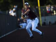 Ridgefield's Cameron Repetti fields a hit to third base during a game against Yakima at the Ridgefield Outdoor Recreation Center on Tuesday night, June 4, 2019.