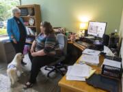 Kim Schneiderman, the executive director of NAMI Southwest Washington, left, talks with Heidi Bjurstrom, program director, in the group’s new offices in downtown Vancouver. Schneiderman said the new location is more accessible. “I wanted to go to people, instead of people coming to us,” she said.