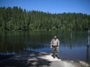 Washington State Parks Area Manager Heath Yeats oversees Battle Ground Lake State Park, where new projects are on the cusp of completion. Three piles are visible in the water behind Yates that will be used for a new ADA-accessible floating dock that will be installed this month. “Folks with limited abilities will be able to go out there and fish,” Yeats said. “It’s a brand-new feature for this park.