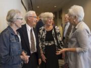 Laura Kalina of Portland, from left, chats with longtime friends Jim and Judith Youde, along with Karen Otis of Beaverton, Ore., before the start of the Community Foundation for Southwest Washington’s luncheon at the Hilton Vancouver Washington Tuesday. The Youdes were honored as the Community Foundation’s 2019 Philanthropists of the Year.