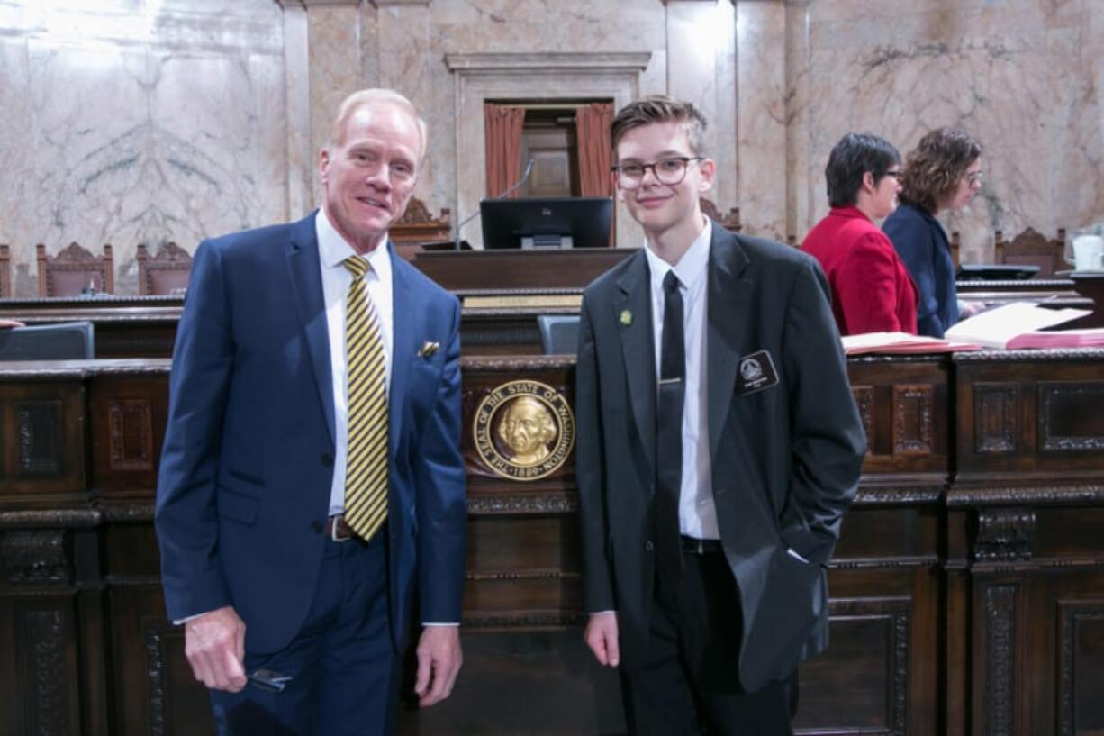 Battle Ground: Rep. Paul Harris, R-Vancouver, left with River HomeLink home school student Sam Weston, who served as a page for Harris.