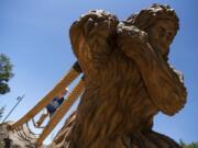 Hayes Hatfield of Camas, 4, climbs on Eegah, the Sasquatch statue in the center of the Port of Camas-Washougal’s new natural play area along the Washougal Waterfront Park walking path. The play structure includes the towering Sasquatch, climbing ropes, logs and musical instruments.