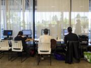 People use the computers at the Vancouver Navigation Center on Tuesday. The center, which opened in November, is designed to be a safe and welcoming space for anyone experiencing homelessness, whether or not they’re ready to seek out long-term housing solutions.