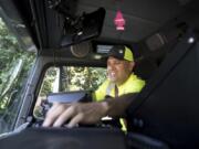 Gabe Duarte, a residential garbage truck driver with Waste Connections, collects garbage in an east Vancouver neighborhood last week. August will mark 15 years on the job for Duarte. The Los Angeles native moved to the area with his father in 1989. He never set out to be a garbage collector. “I think it’s decent. I’ve been able to raise my family, my two kids. The benefits are good, I believe. My wife and daughter have different medication they need. It’s helped with that,” Duarte said.