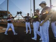 The Raptors' Jonny Weaver, left, celebrates his home run in the second inning during their match against the Port Angeles Lefties at the Ridgefield Outdoor Recreation Complex on Friday night, June 14, 2019.