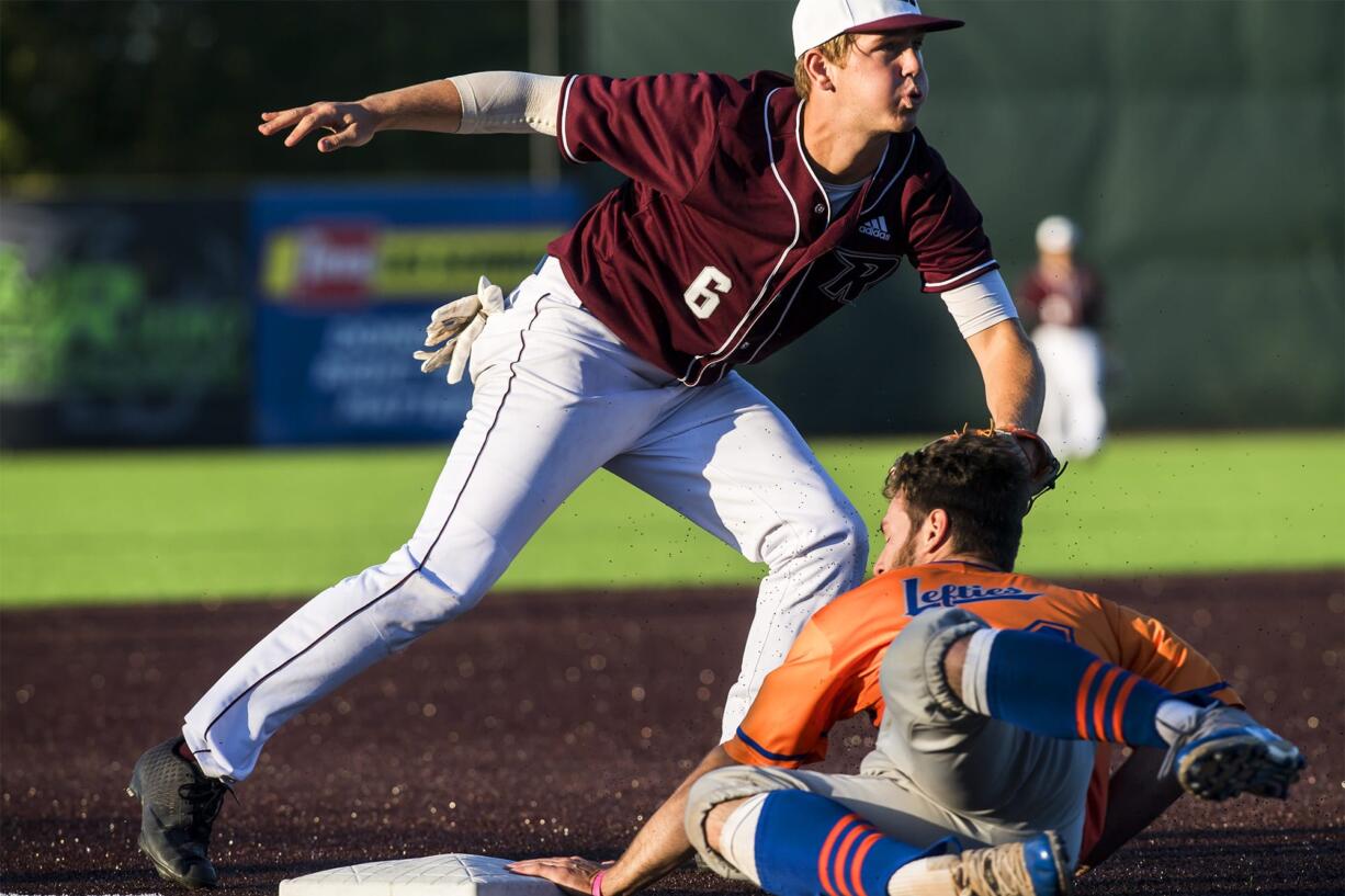 Ridgefield's Cameron Repetti lands a tag on a Port Angeles baserunner Lefties at the Ridgefield Outdoor Recreation Complex on Friday night, June 14, 2019.