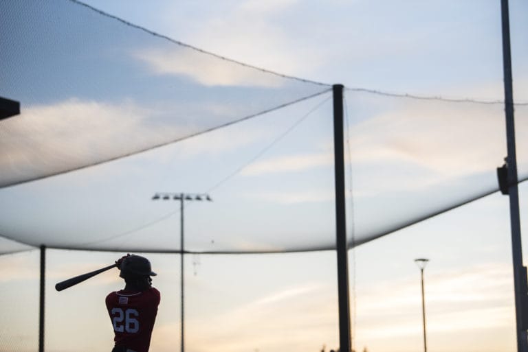 Walla Walla's Emmanuel Dean warms up while on deck to bat during a game against the Raptors in Ridgefield on Friday night, June 28, 2019.(Nathan Howard/The Columbian)