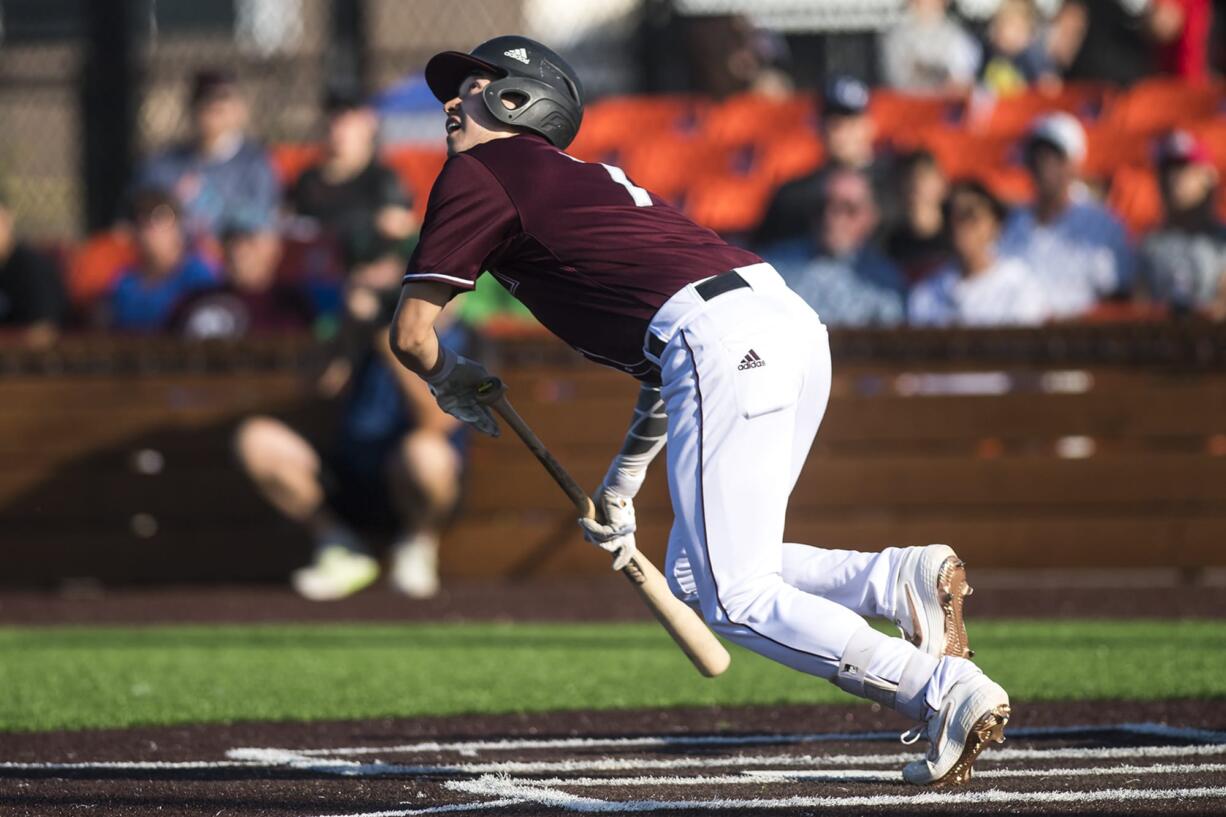 Ridgefield's Jonny Weaver watches his bunt while running to first during their game against Walla Walla in Ridgefield on Friday night, June 28, 2019.(Nathan Howard/The Columbian)